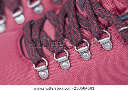 A close up image of red  mountaineering boot