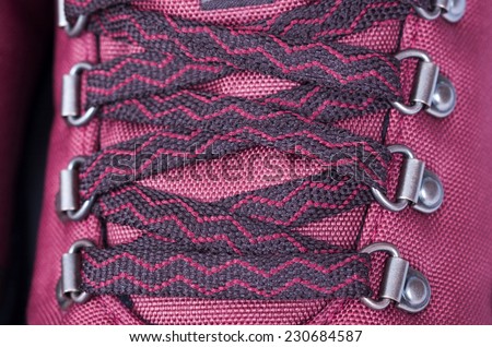 A close up image of red  mountaineering boot