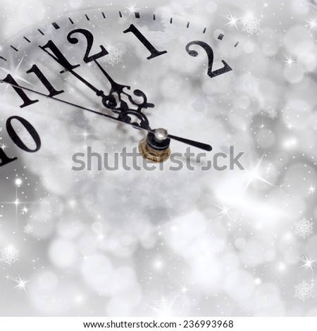 New Year\'s at midnight - old clock in snow