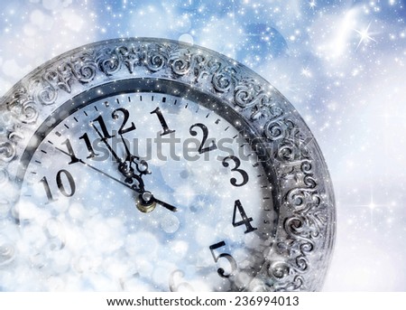 New Year\'s at midnight - old clock in snow