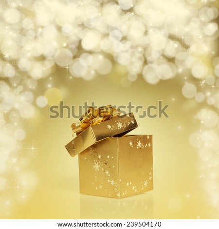 abstract holiday background with golden gift box and fireworks