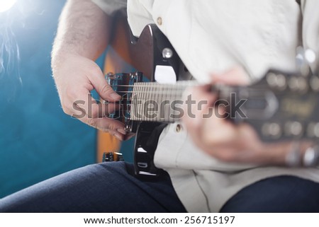 Guitarist on stage in the stage light