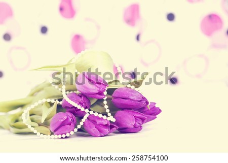 Vintage still life with purple tulips