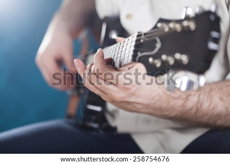 Guitarist on stage in the stage light - retro photo