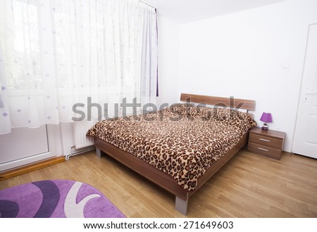Bedroom with pastel purple wall