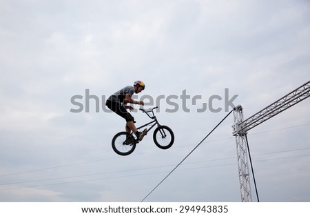 BONTIDA, ROMANIA - JUNE 27, 2015: Unidentified BMX rider making a bike jump during the BMX Competition, at Electric Castle Festival.