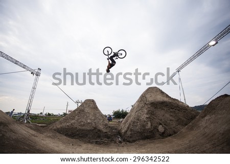 Bontida, Romania - June 27, 2015: Unidentified BMX rider making a bike jump during the BMX Competition, at Electric Castle Festival, Bontida, Romania