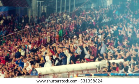 Defocused background of crowd of people in a basketball court