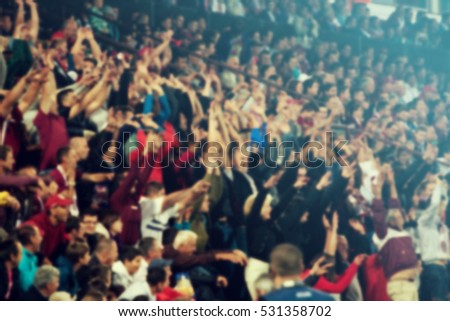 Defocused background of crowd of people in a basketball court