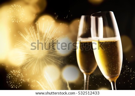 toasting with champagne glasses on sparkling holiday background - Fireworks at New Year and copy space