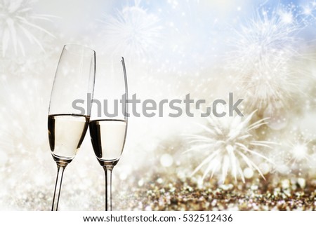 toasting with champagne glasses on sparkling holiday background - Fireworks at New Year and copy space
