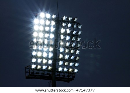 Stadium lights and dark blue sky