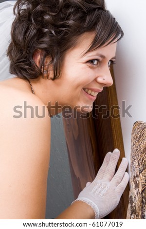 Bride waiting for her fiancee at door
