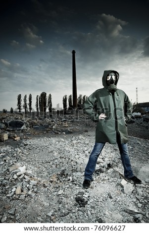 Woman in gas mask on demolished industrial background with pipes
