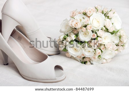 stock photo Wedding bouquet of pink and white roses and bride 39s shoes