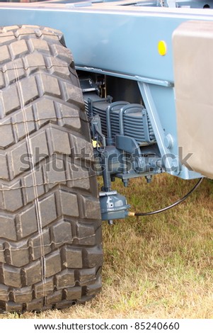 shock absorber and tire of a large farm trailer