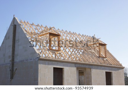 house under construction with the roof structure of wood