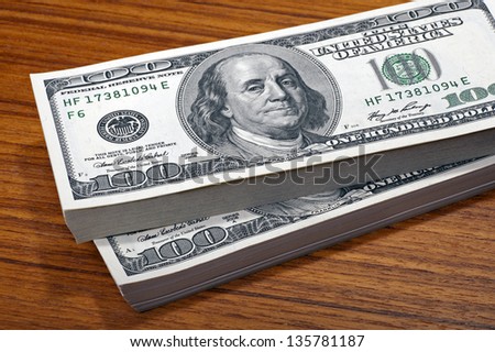 100 dollars bills in the stack, heap of dollars, money background