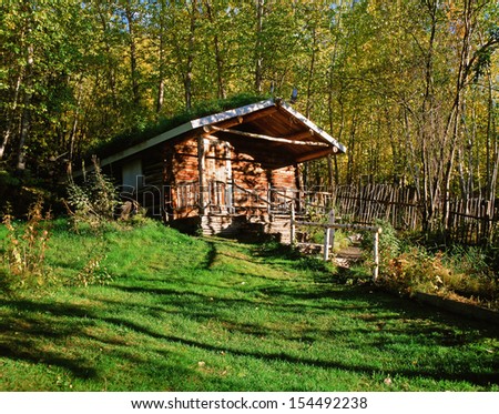 Wooden Cottage in forest - hunter\'s cottage in the fall