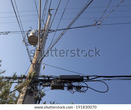 Confusion of wires - pole with transformers, lines and wires