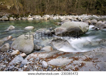 Capilano Mountains - Capilano River flows through large boulders, the drinking water in nature