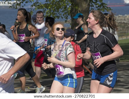 THE VANCOUVER SUN RUN, APRIL 19, 2015: Sponsored by Vancouver Sun newspaper, the 10-kilometer run is one of the largest road races in North America. Event is held yearly in April's Sunday since 1985.