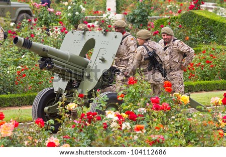 VALLADOLID, SPAIN-JUNE 2: Group of soldiers with a cannon in a garden in the Armed Forces Day 2012, on June 2, 2012 in Valladolid, Spain.