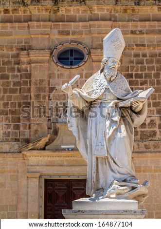 Saint Augustine statue in front of the St Augustine convent in Victoria, Gozo, Malta.