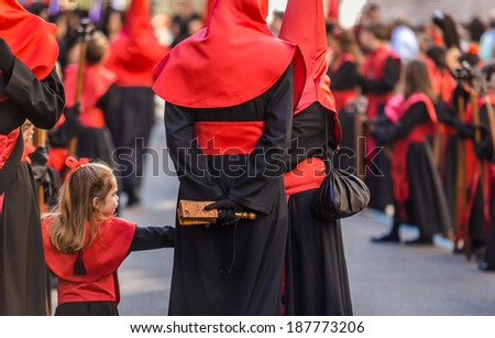 VALLADOLID, SPAIN Ã¢Â?Â? APRIL 17, 2014: Little girl participating in the religious processions during Holy Week on Good Thursday, on April 17, 2014 in Valladolid, Spain.