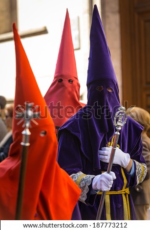 VALLADOLID, SPAIN - APRIL 17, 2014: Colorful nazarenos in the religious processions during Holy Week on Good Thursday, on April 17, 2014 in Valladolid, Spain.