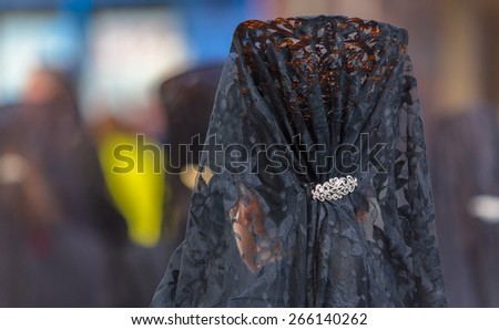 Back side of a woman with a comb in the Good Thursday during Holy Week in Valladolid.