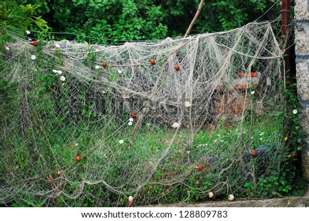 Fish net hanging on the fence to dry