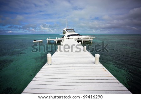 A yacht docked on Half Moon Caye Belize