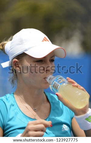 SYDNEY - JAN 8: Maria Kirilenko from the Russia drinks at the change of ends in her doubles match at the APIA Sydney Tennis International. Sydney January 8, 2013.