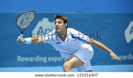 SYDNEY - JAN 9: Marcel Granollers from Spain reaches for a forehand at the APIA Sydney Tennis International. Sydney January 9, 2013.
