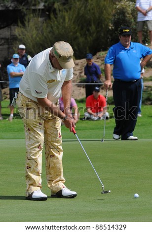 SYDNEY - NOVEMBER 10: John Daly putts in the first round in the Australian Open at The Lakes golf course on November 10, 2011 in Sydney, Australia.