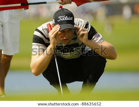 SYDNEY - NOV 11: American golfer Nick Watney studies his line during the second round in the Australian Open at The Lakes golf course. Sydney, November 11, 2011