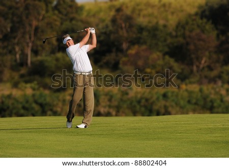 SYDNEY - NOV 11: - John Cook watches his ball fly high and straight at the Emirates Australian Open at The Lakes golf course. Sydney - November 11, 2011