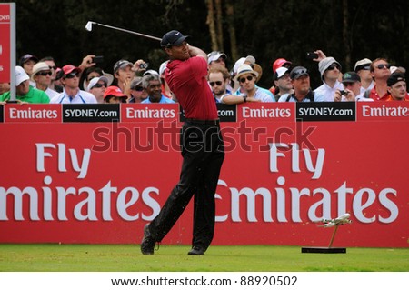 SYDNEY - NOV 13: American golfer Tiger Woods plays a iron from the 16th tee in his fourth round at the Emirates Australian Open at The Lakes golf course on November 13, 2011 in Sydney, Australia.