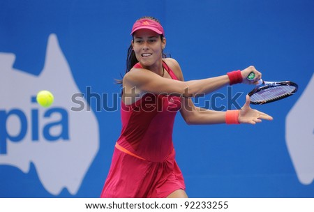 SYDNEY - JAN 8: Serbian Ana Ivanovic hits a forehand during her first round match in the APIA Tennis International. Sydney - January 8, 2012
