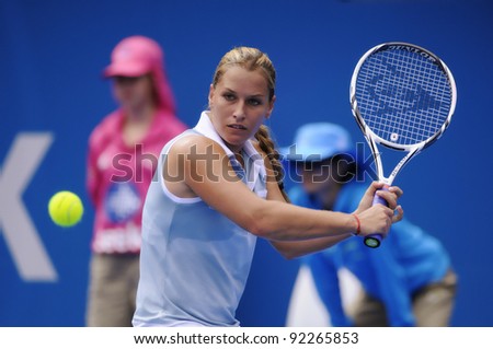 SYDNEY - JAN 8: Dominika Cibulkova plays a backhand in her first round match in the APIA Tennis International. Sydney - January 8, 2012