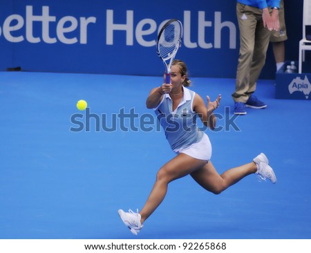 SYDNEY - JAN 8: Dominika Cibulkova plays a forehand on the run, in her first round match in the APIA Tennis International. Sydney - January 8, 2012