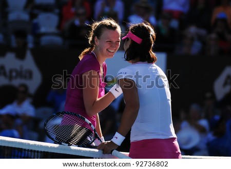SYDNEY - JAN 12: Li Na and Petra Kvitova shake hands as friends at the APIA Tennis International. Sydney - January 12, 2012