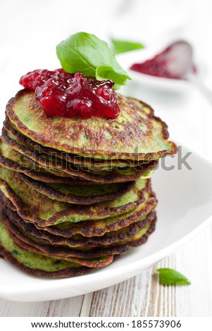 Healthy and delicious spinach pancakes with lingonberry jelly
