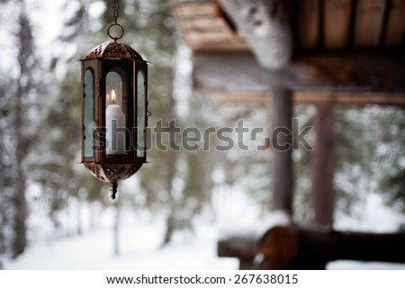 Porch decorated with lanterns and Christmas lights