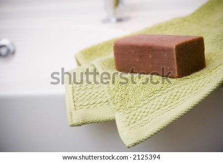 Green towel and brown soap