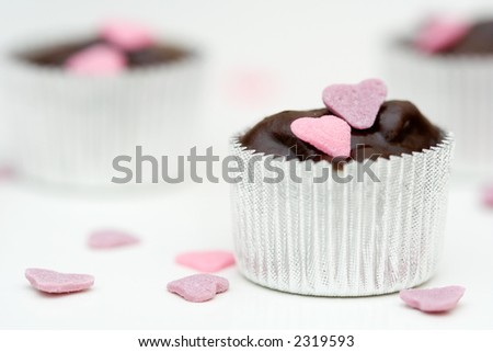 Homemade chocolate with pink and purple heart decorations