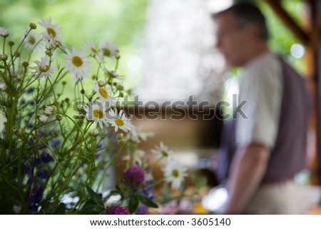 Senior man cooking food in barbeque grill