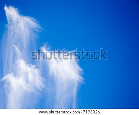 Funny clouds on bright blue sky