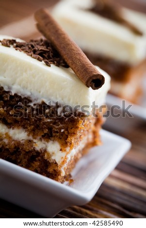 Delicious pieces of carrot cake with cinnamon stick